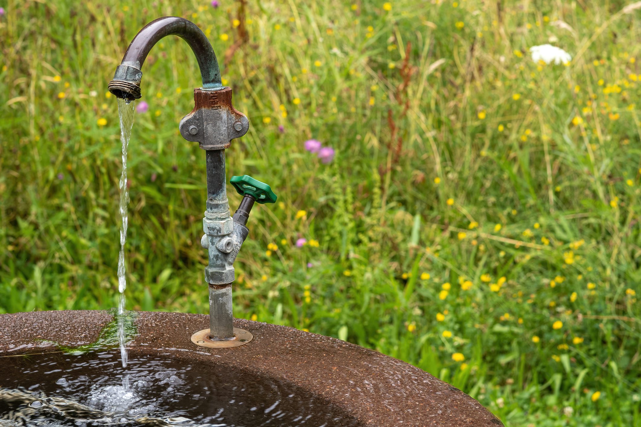 Outdoor faucet with flowing water